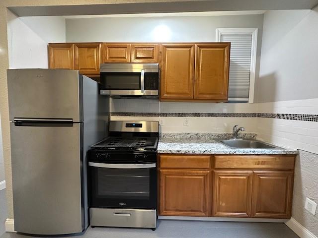 kitchen featuring appliances with stainless steel finishes and sink