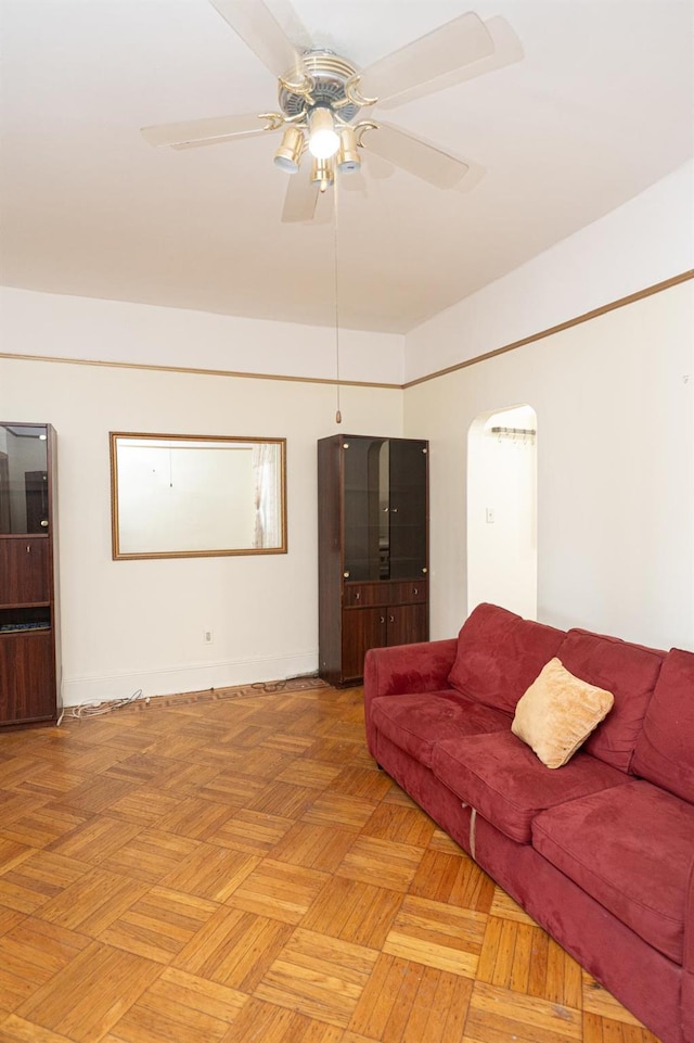 living room with ceiling fan and light parquet floors