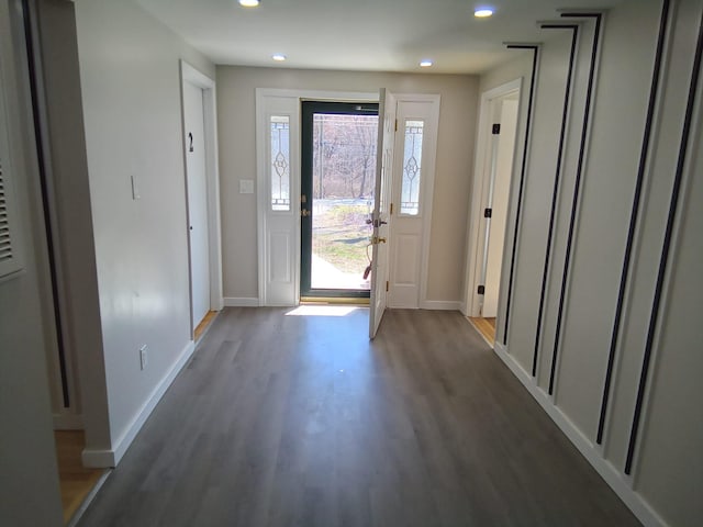 foyer entrance with dark hardwood / wood-style floors