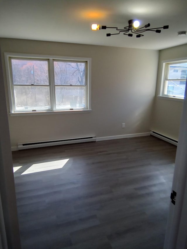 129 Franklin Ave, Monroe, NY 10950 - unfurnished room featuring a baseboard radiator and dark hardwood / wood-style floors