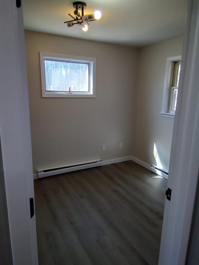 129 Franklin Ave, Monroe, NY 10950 - empty room with dark hardwood / wood-style flooring and baseboard heating