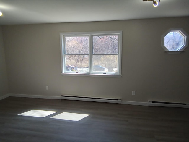 129 Franklin Ave, Monroe, NY 10950 - unfurnished room with a baseboard heating unit and dark wood-type flooring