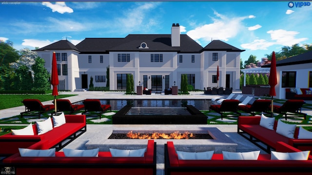 rear view of house with a patio area and an outdoor living space with a fire pit