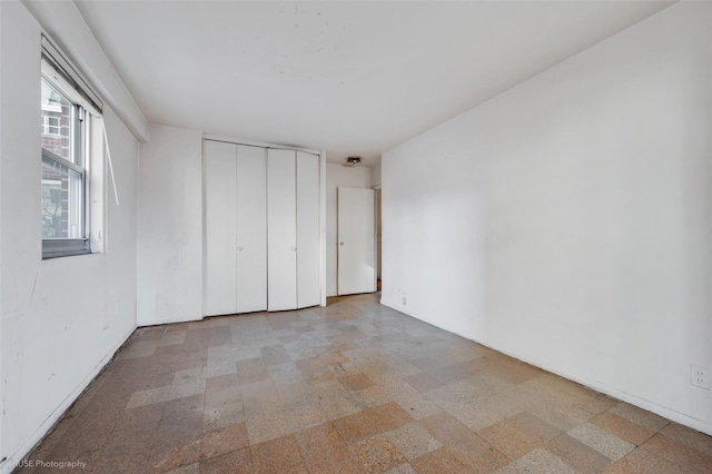 unfurnished bedroom featuring a closet