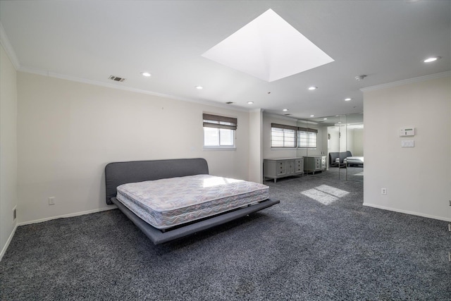 carpeted bedroom featuring crown molding and a skylight