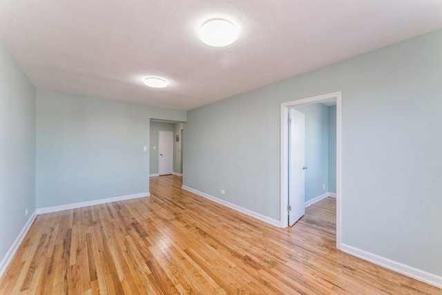 spare room featuring light hardwood / wood-style floors