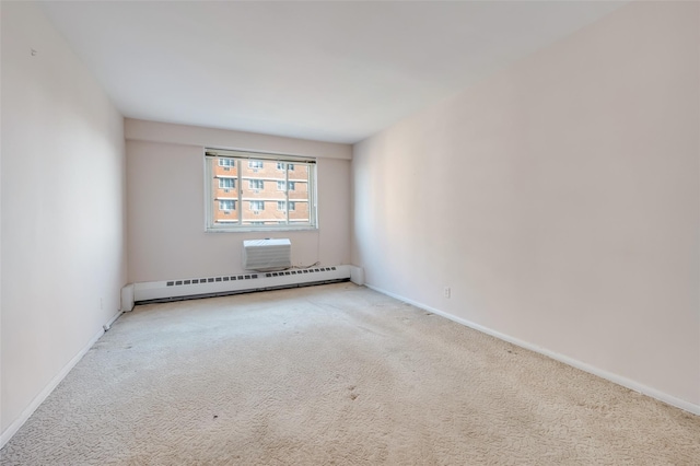 carpeted empty room with a baseboard heating unit