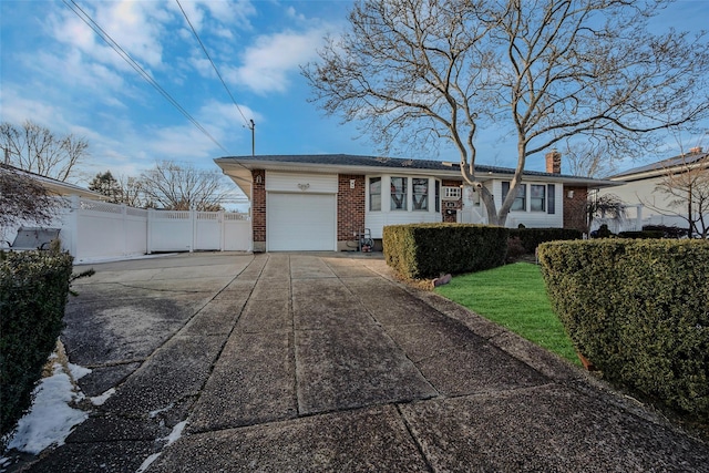 ranch-style house featuring a garage