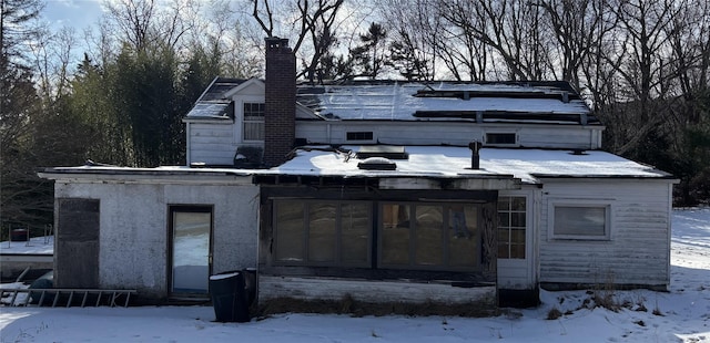 view of front of house with a sunroom