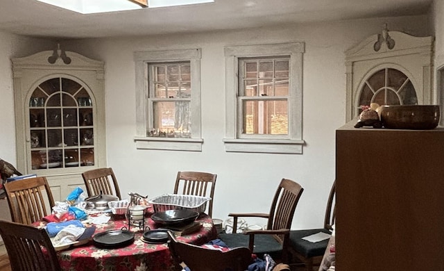 dining space featuring a skylight