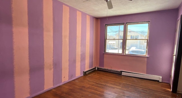 unfurnished room with dark hardwood / wood-style floors, a textured ceiling, ceiling fan, and baseboard heating