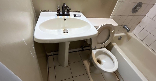 bathroom with tile patterned floors and toilet