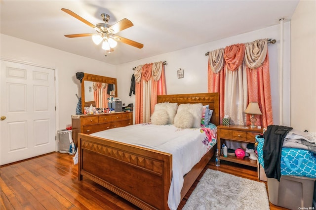 bedroom featuring hardwood / wood-style flooring and ceiling fan