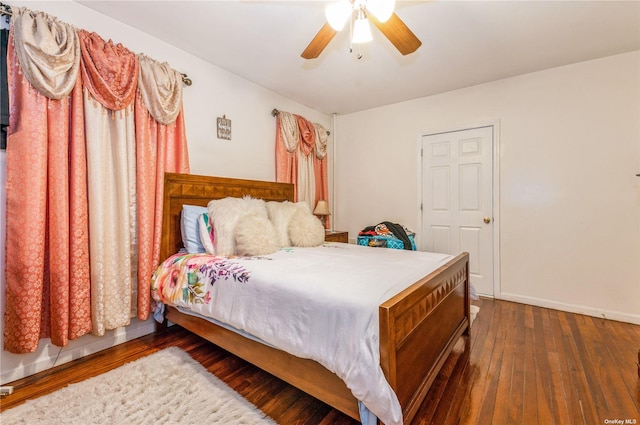 bedroom featuring dark hardwood / wood-style floors and ceiling fan