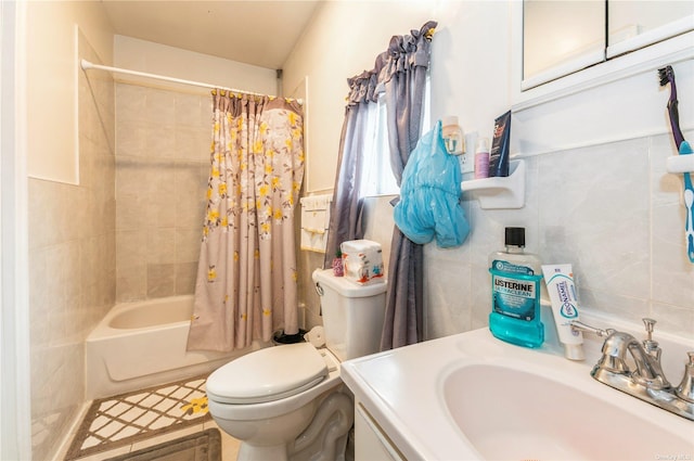 full bathroom featuring toilet, tasteful backsplash, tile walls, vanity, and shower / bath combo