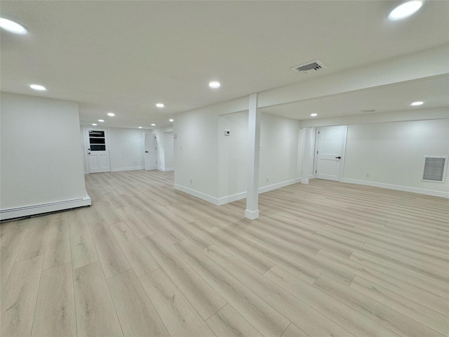 basement featuring light hardwood / wood-style floors