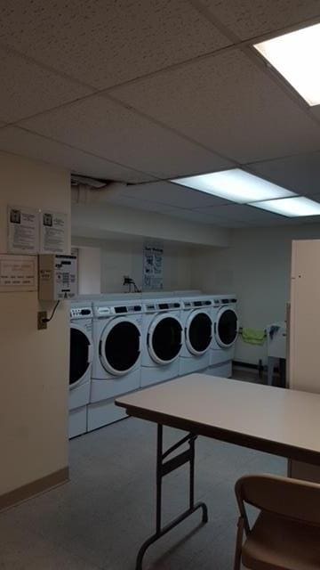 clothes washing area featuring separate washer and dryer