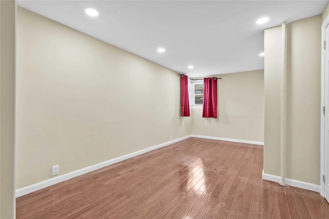 spare room featuring hardwood / wood-style flooring