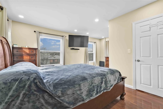 bedroom featuring dark hardwood / wood-style flooring