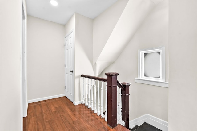 hallway with dark hardwood / wood-style floors