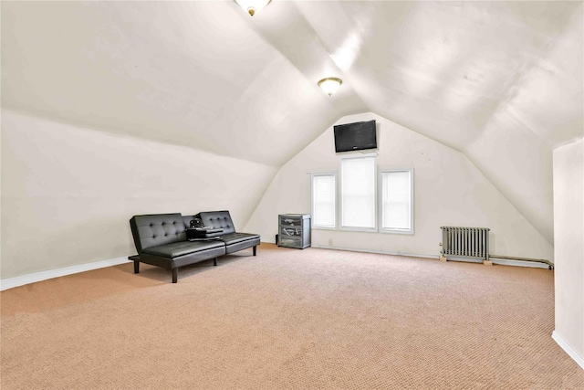 bonus room featuring lofted ceiling, radiator heating unit, and carpet