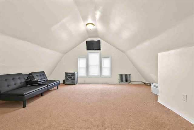 additional living space featuring carpet flooring, radiator heating unit, and vaulted ceiling