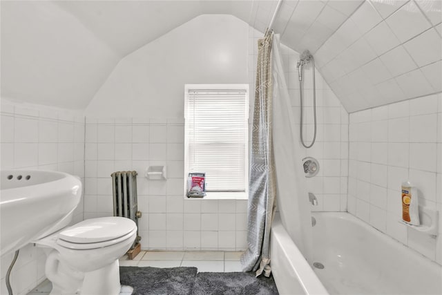 full bathroom with toilet, radiator, vaulted ceiling, and tile walls