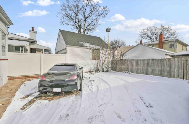 view of yard layered in snow