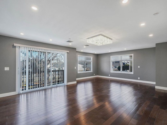 unfurnished room featuring dark hardwood / wood-style flooring