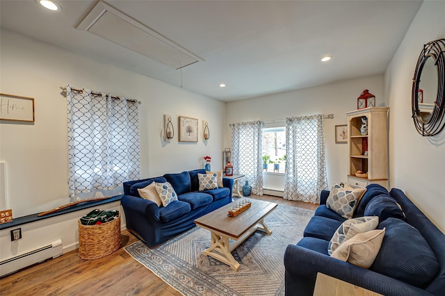 living room featuring hardwood / wood-style flooring and baseboard heating