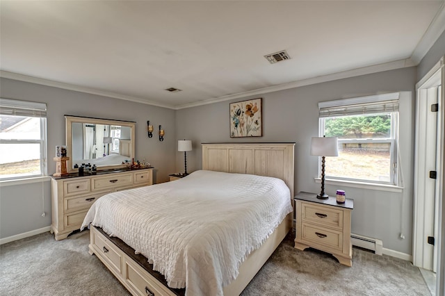 bedroom with crown molding, a baseboard heating unit, and light colored carpet