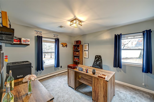 carpeted home office with a baseboard heating unit