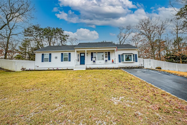 ranch-style house with a front lawn and a porch