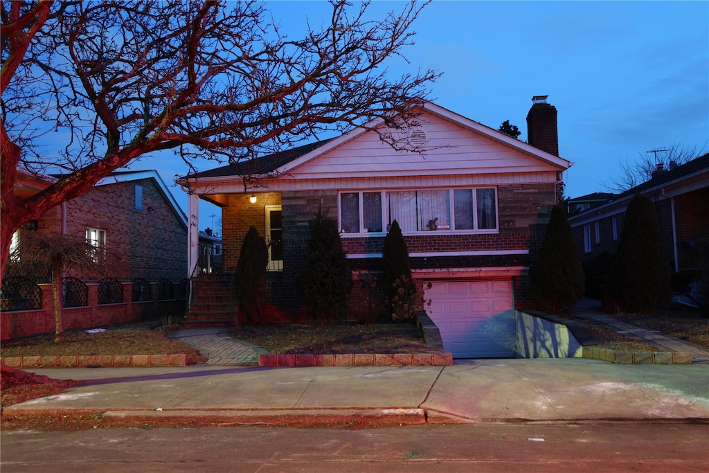 view of front of property with a garage