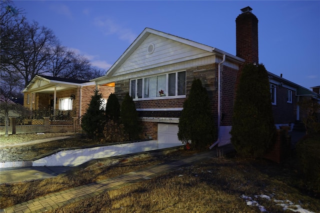 view of front of property featuring a garage