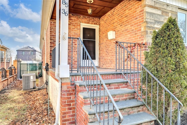 property entrance featuring central AC unit