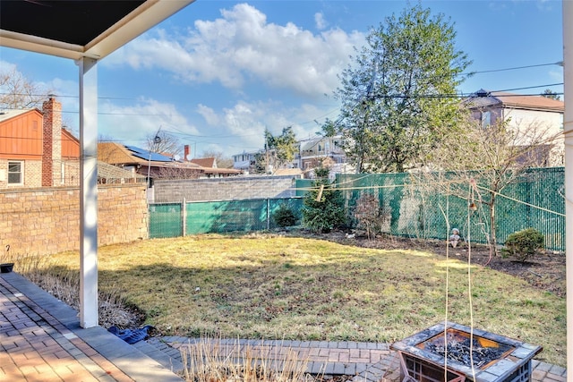 view of yard featuring a patio area and a fire pit