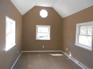 additional living space featuring lofted ceiling, a baseboard radiator, and carpet flooring