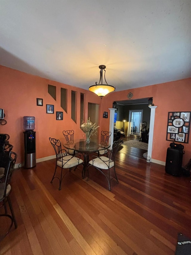 dining area with wood-type flooring