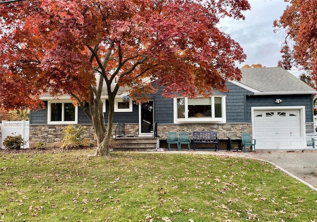 view of front of home with a garage and a front yard