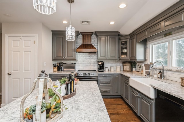 kitchen featuring sink, hanging light fixtures, black dishwasher, custom range hood, and electric stove