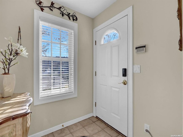 tiled foyer entrance featuring a wealth of natural light