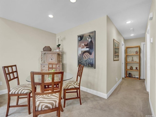 view of carpeted dining space