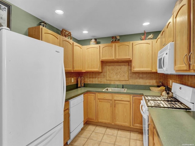 kitchen featuring sink, white appliances, light tile patterned floors, decorative backsplash, and light brown cabinets