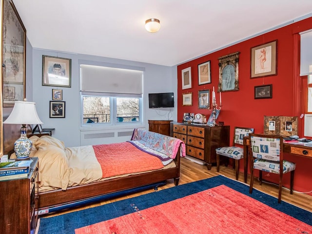 bedroom featuring hardwood / wood-style flooring