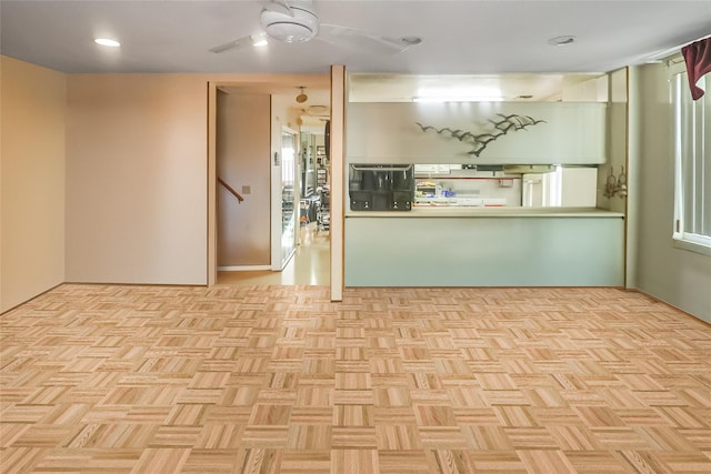 kitchen featuring light parquet flooring and ceiling fan