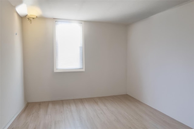 unfurnished room featuring light hardwood / wood-style flooring