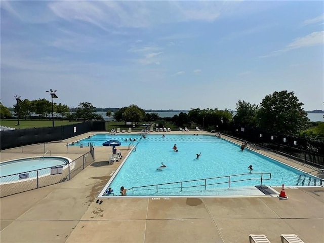 view of swimming pool with a patio area