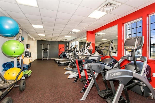 workout area with a drop ceiling