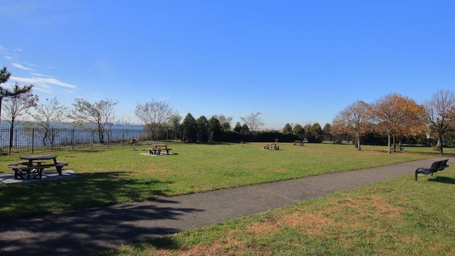 view of home's community featuring a lawn